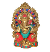 Brass Ganesha idol front view, detailed face, circular halo, red and teal dhoti
