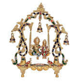 Ornate brass Radha-Krishna swing jhula with hanging diya lamps and decorated base