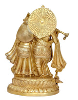 Brass Radha Krishna statue from back angle, ornate crown and fluted base