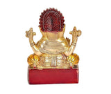 Brass Ganesha idol statue, back view, red base block, detailed ornaments