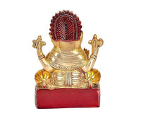Brass Ganesha idol statue, back view, red base block, detailed ornaments