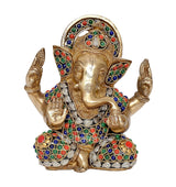Brass Ganesh statue front view with ornate crown and colorful gem inlay, raised arms