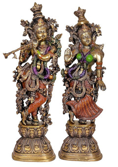 Brass Radha Krishna sculpture pair, full-view with green accents and ornate jewelry, 29 in