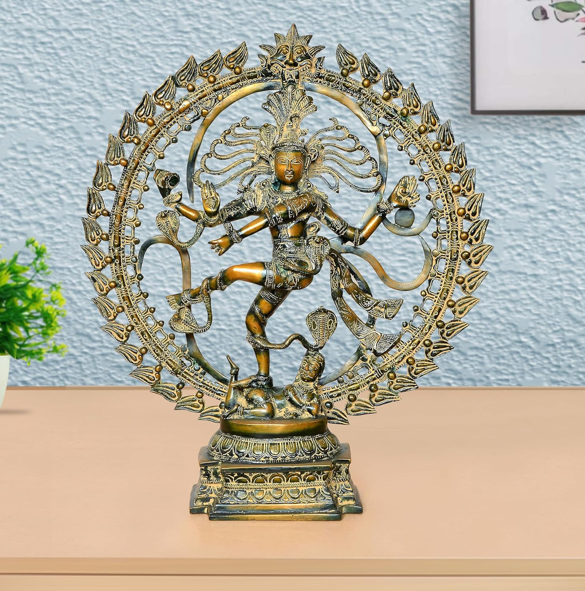 Brass Natraj Lord Shiva dancing idol with ornate circular halo and raised arms