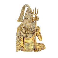 Brass Shiva statue back view, long flowing hair and trident staff