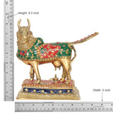 Brass cow statue height 8.5 in, width 9 in, green-red body with decorated base