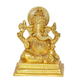 Brass Ganesha statue facing front, seated posture with detailed jewelry and halo