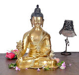 Brass Buddha statue in meditation pose, 15 inches tall