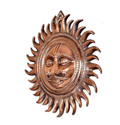 Large metal sun statue with circular halo ring, serene face, copper-brown rays