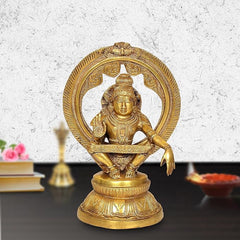 Seated Lord Ayyappan brass statue with carved arch frame and Kirtimukha, gold