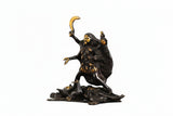 Brass Kali Maa idol: gold face, one hand raised, other holding trident-like weapon