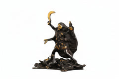 Brass Kali Maa idol: gold face, one hand raised, other holding trident-like weapon