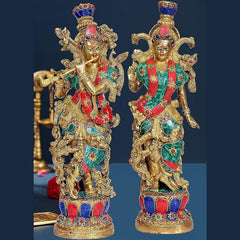 2 idols: ornate gold, teal & red deity figurines with painted eyes and crowns