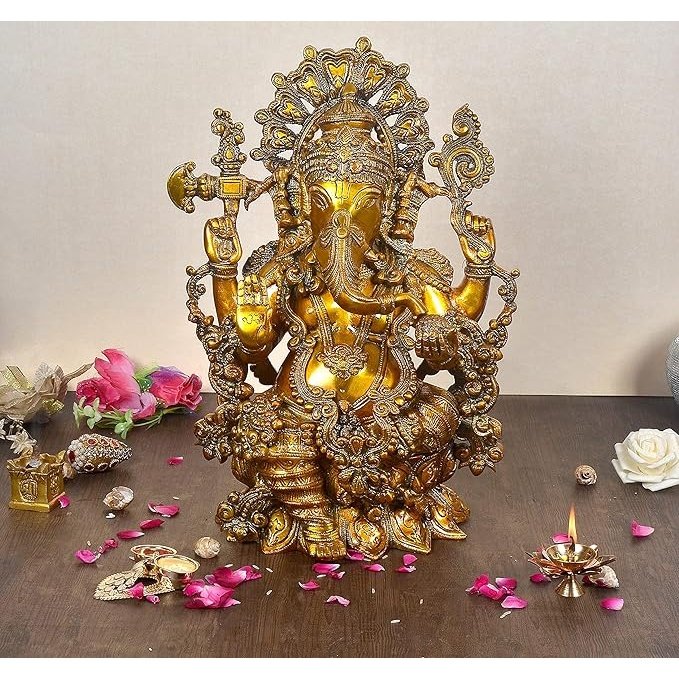 Brass Ganesha idol, ornate crown and four arms, seated; 16-inch height