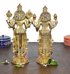 Gold-tone Vishnu and Lakshmi idol statue, side view with multi-armed design