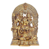 Brass Shiv Parivar idol, front view: four figures seated with decorative halo arch