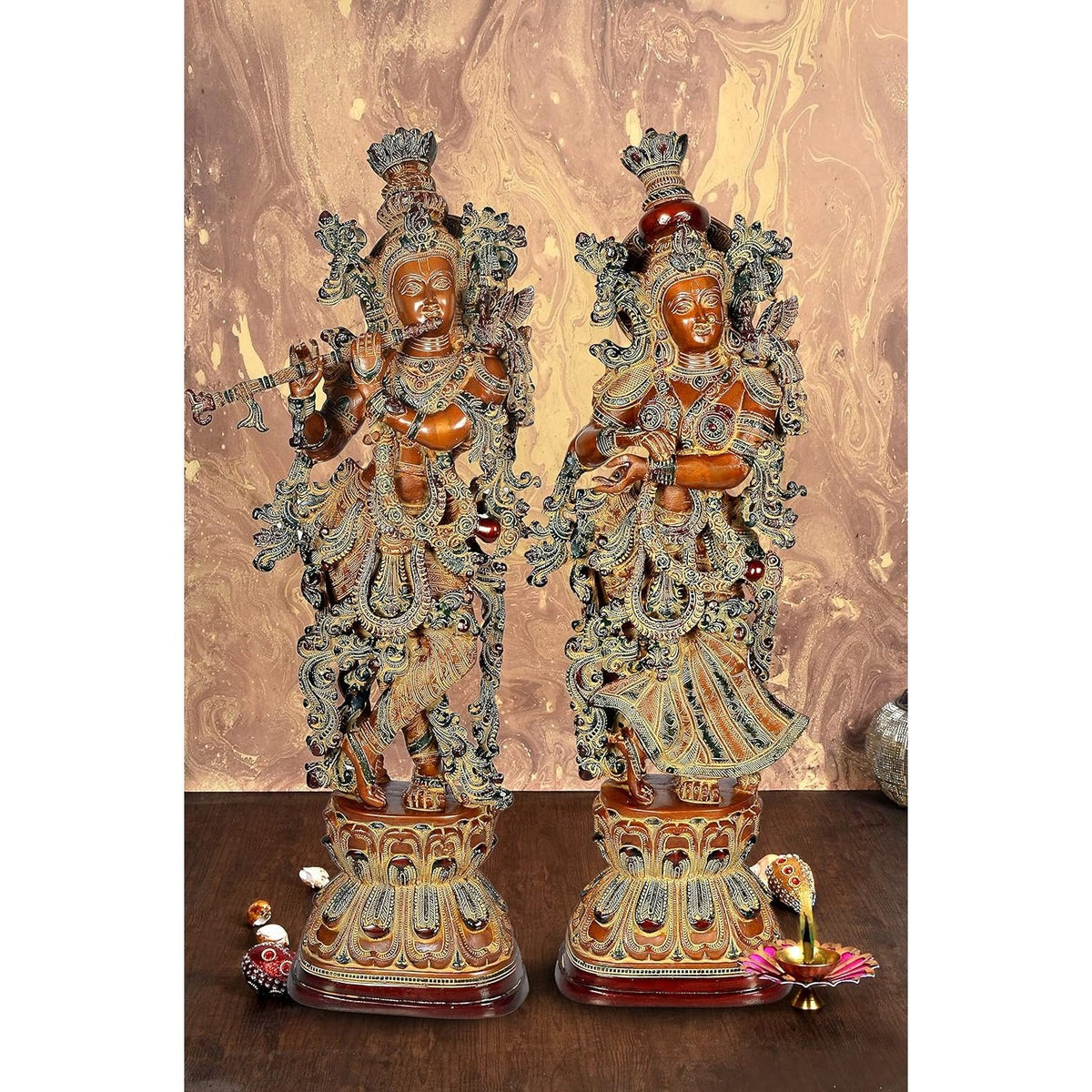 Brass Radha Krishna figurine, two standing poses on ornate pedestal, brown