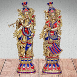 Radha-Krishna brass Murti pair: two statues front view, gold with blue-red detailing