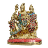 Brass Shiva family idol, central figure with blue-red gem patterns, red cushion base