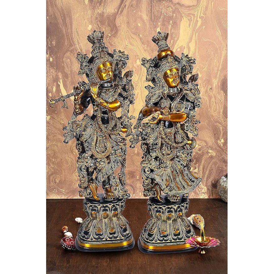 Black brass Radha Krishna idol, two standing figures with ornate crowns and jewelry