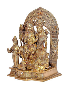 Brass Shiv Parivar idol, side view: seated Shiva family with standing attendants