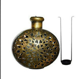 Decorative bronze iron pot with ornate floral cutout pattern and narrow neck