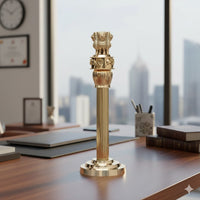 Brass Ashoka stambh showpiece, lion-cap finial on ribbed pedestal base