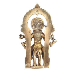 Back view of Brass Harsiddhi Maa idol with circular halo and seated figure on base
