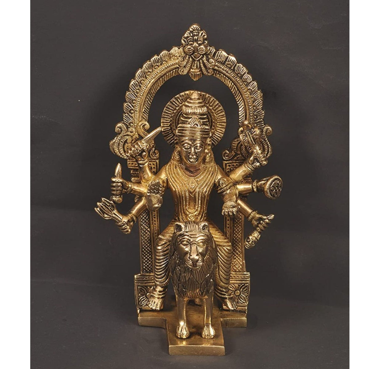 Brass Harsiddhi Maa idol with arch, four arms, and lion base pedestal