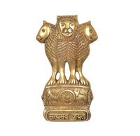Gold-toned brass Ashoka Stambh wall hanging featuring lion and wheel emblem
