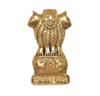 Gold-toned Ashoka stambh wall hanging with smiling face, lion arms, and wheel panel