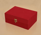 Red velvet gift box with gold clasp and hinge