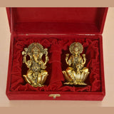 Golden brass Ganesh idol with ornate detailing in velvet presentation box