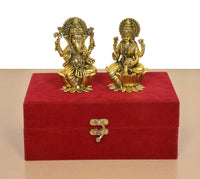 Golden brass Lakshmi idol, seated on lotus in velvet presentation box