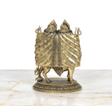 Brass Chamunda idol rear view: two crowned figures with patterned drape over their backs