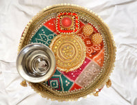 AONA INDIA handcrafted pooja thali plate top view with silver bowl and red, green, gold motifs
