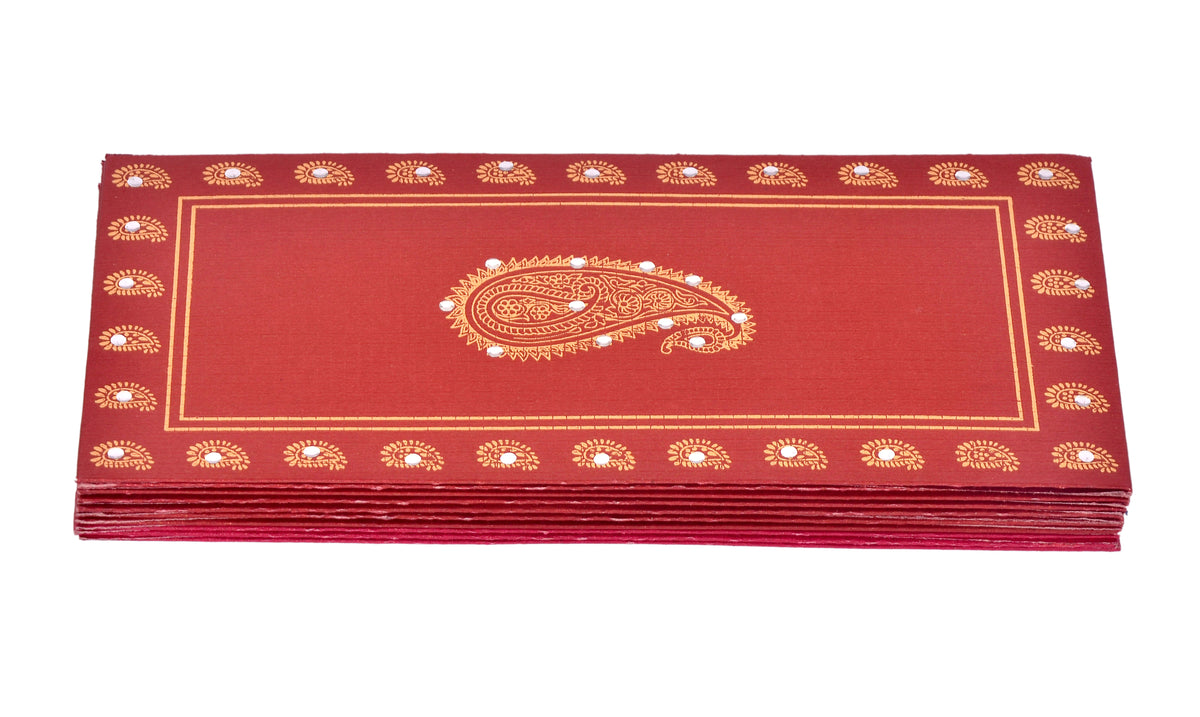 Red handmade shagun envelopes with ambi design and gold border, stacked.