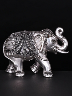 Silver brass elephant figurine, rear angle with ornate back etching and trunk up