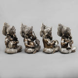 Brass musician Ganesh idol, seated with detailed ornaments and musical accessories