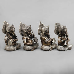 Brass musician Ganesh idol, seated with detailed ornaments and musical accessories