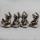 Brass musician Ganesh idol figurine, seated and holding a small drum and disc