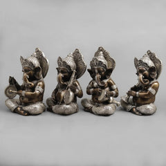 Brass musician Ganesh idol figurine, seated and holding a small drum and disc