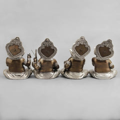 Brass musician Ganesh idol back view, seated on ornate patterned base