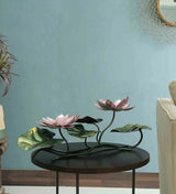 Iron lotus showpiece with pink flowers on black circular base, green leaf accents