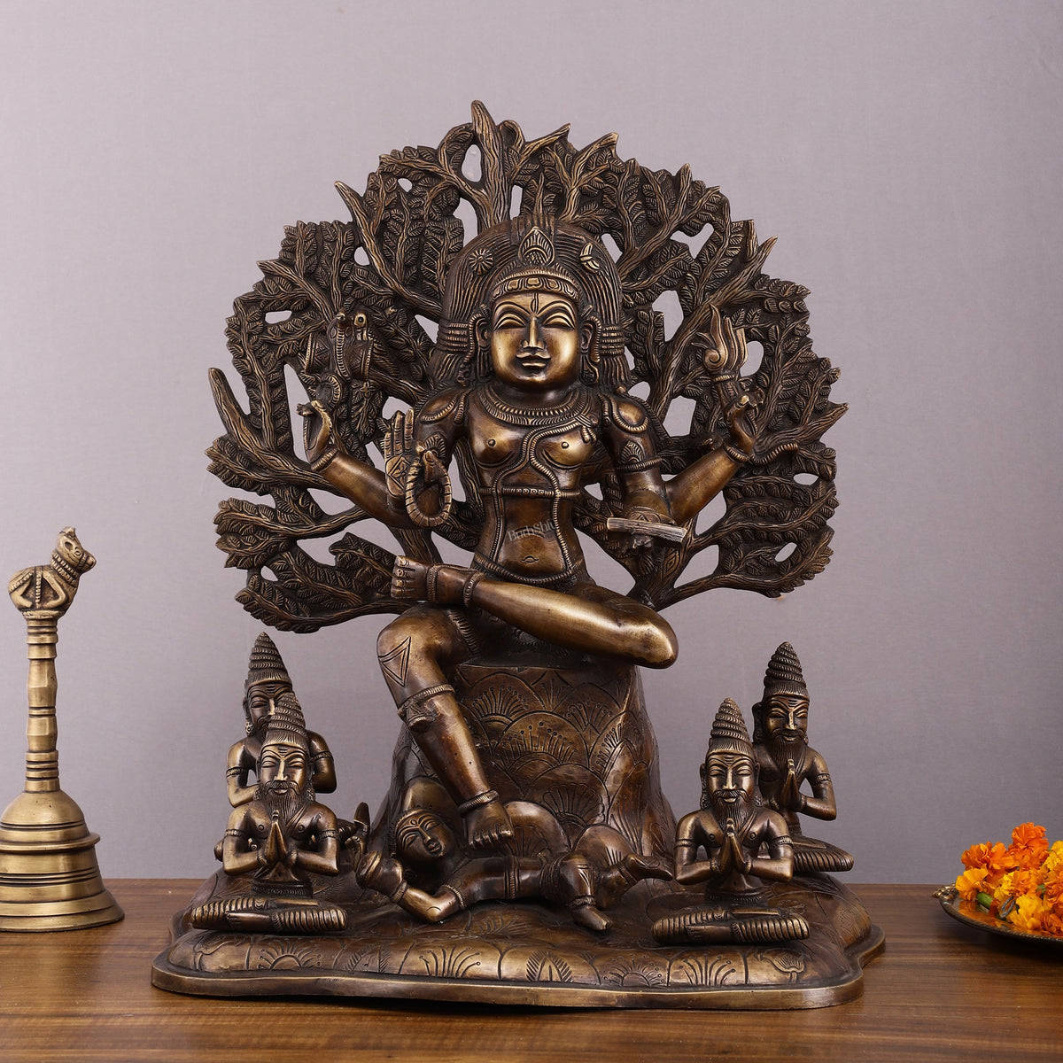 Large 18-inch brass Dakshinamurthy statue with serene figure seated on leaf base