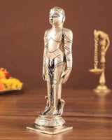Brass Jain standing statue, three-quarter view with hands in side pose