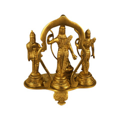 Brass Hindu deity statue with central standing figure and two side devotees under arched frame