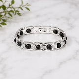 Silver link bracelet with dark round ebony-style beads and textured rectangular links