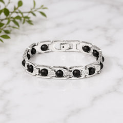 Silver link bracelet with dark round ebony-style beads and textured rectangular links