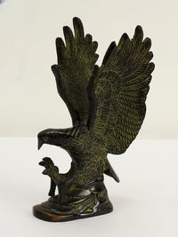 Brass eagle figurine with outstretched wings and detailed feather relief, 8 in height